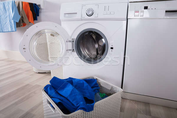 Empty Washing Machine With Pile Of Dirty Clothes Stock photo © AndreyPopov