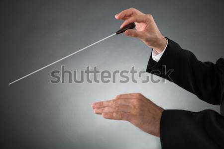 Music conductor with a baton Stock photo © AndreyPopov