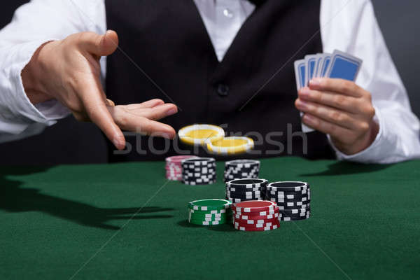 Poker player increasing his stakes Stock photo © AndreyPopov