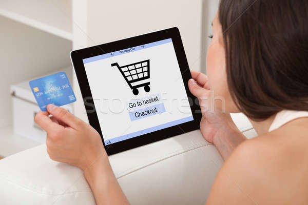 Woman With Credit Card Shopping Online On Digital Tablet Stock photo © AndreyPopov