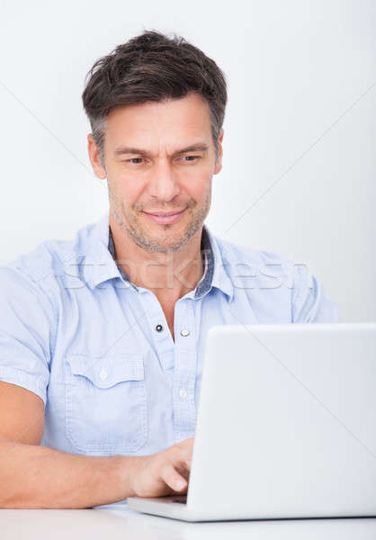 Man Using Laptop Stock photo © AndreyPopov