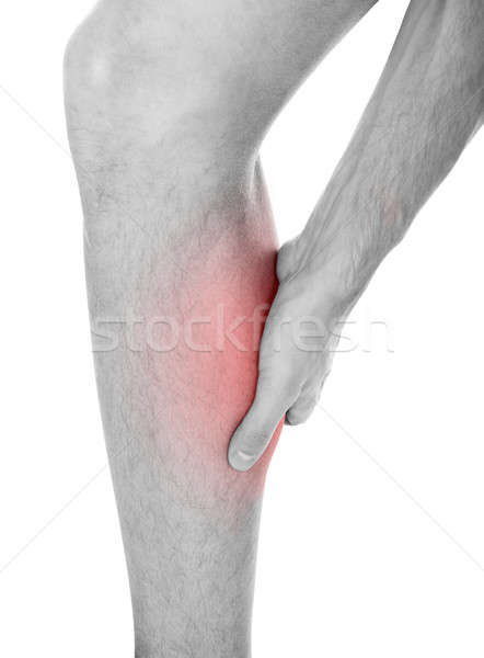 Uomo gamba lesioni primo piano sofferenza bianco Foto d'archivio © AndreyPopov