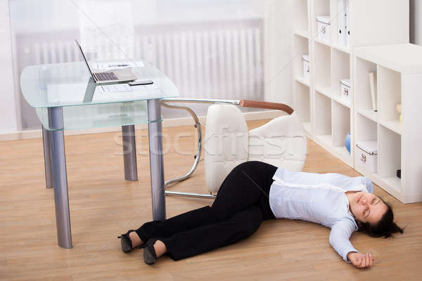 Businesswoman Fainted On Floor Stock photo © AndreyPopov