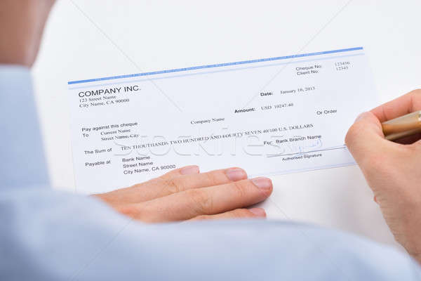 Homme d'affaires signature chèque mains stylo [[stock_photo]] © AndreyPopov
