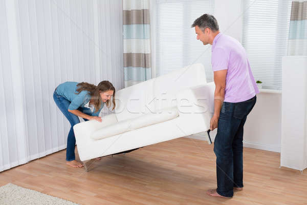 Couple Trying To Move A Couch Stock photo © AndreyPopov