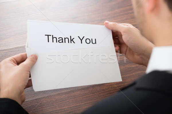 Businessman Holding Thank You Card In Envelope Stock photo © AndreyPopov