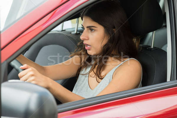 Сток-фото: женщину · сидят · внутри · автомобилей