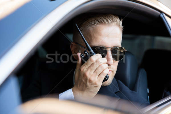 Férfi beszél adóvevő ül bent autó Stock fotó © AndreyPopov