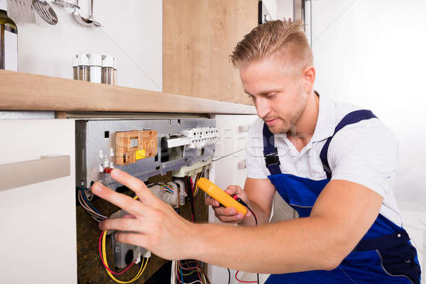 Férfi technikus megjavít mosogatógép fiatal digitális Stock fotó © AndreyPopov