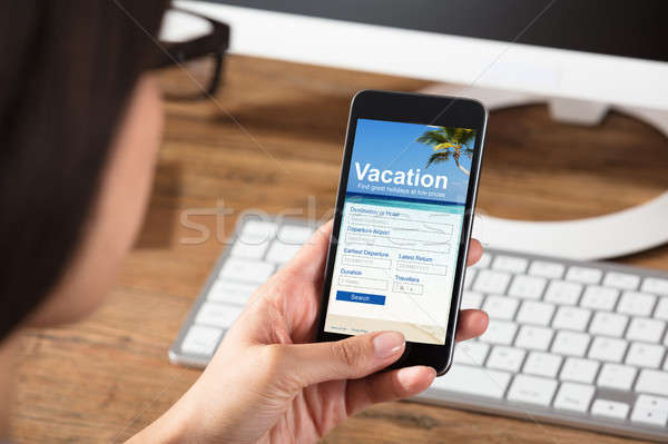 Woman Filling Online Vacation Form Stock photo © AndreyPopov