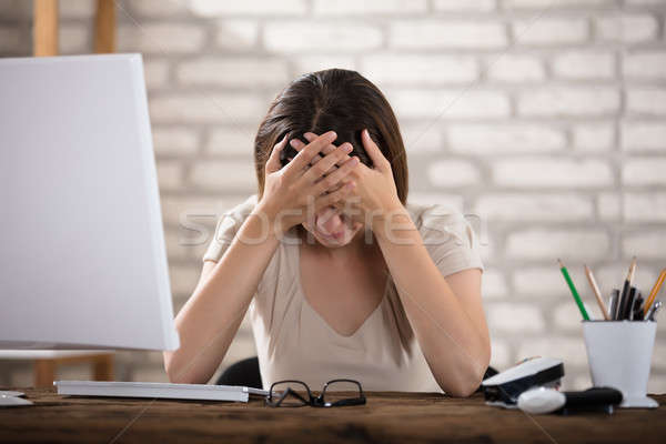 Stock photo: Woman Suffering From Migraine
