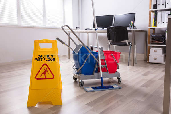 Wet Floor Caution Sign On Floor Stock photo © AndreyPopov