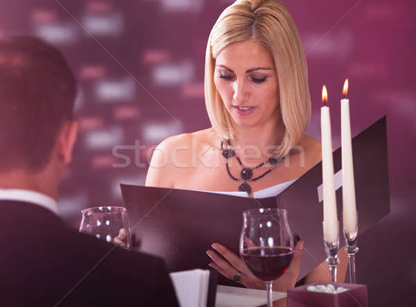 Young Woman Choosing Menu Stock photo © AndreyPopov