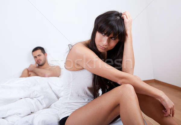 Kłócić się domu posiedzenia bed kobieta Zdjęcia stock © AndreyPopov