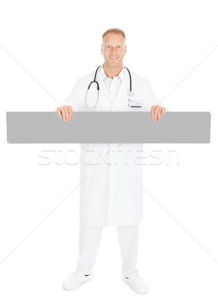 Doctor Holding Wooden Plank Stock photo © AndreyPopov