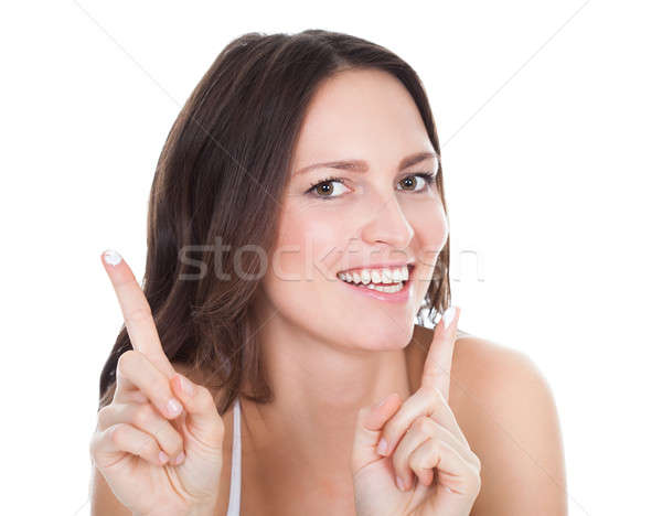 Mujer crema hidratante crema dedo feliz Foto stock © AndreyPopov