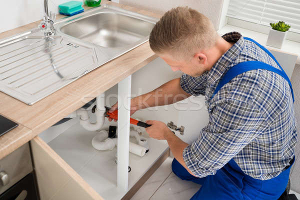 Plumber Fixing Sink Pipe Stock photo © AndreyPopov