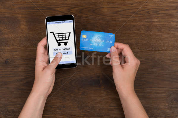 Stock photo: Person Shopping Online With Credit Card On Mobile Phone