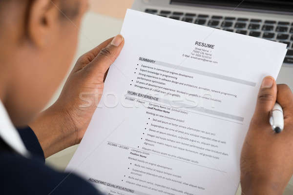 Businesswoman Hand Holding Resume Stock photo © AndreyPopov
