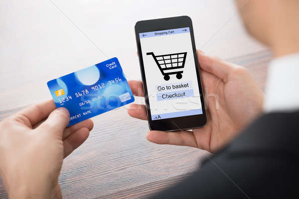 Imprenditore shopping online cellulare primo piano Foto d'archivio © AndreyPopov