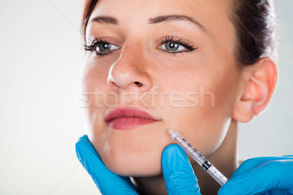 Vrouw cosmetische injectie lip jonge vrouw Stockfoto © AndreyPopov