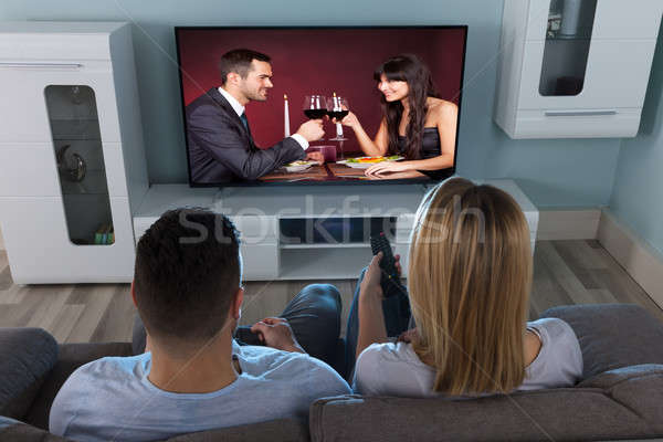 Pár tv nézés otthon közelkép néz élvezi Stock fotó © AndreyPopov