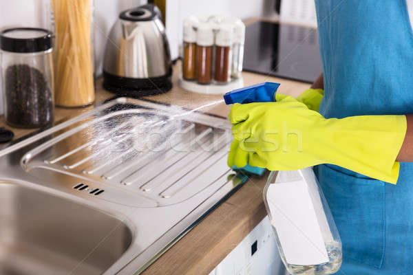 Személy spray üveg takarítás mosogató közelkép Stock fotó © AndreyPopov