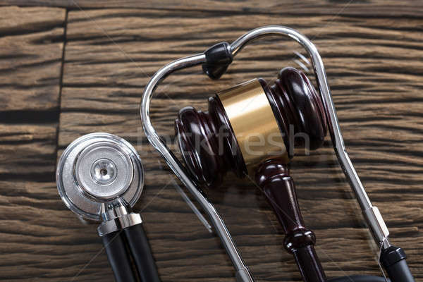 Stethoscope And Gavel On Wooden Desk Stock photo © AndreyPopov
