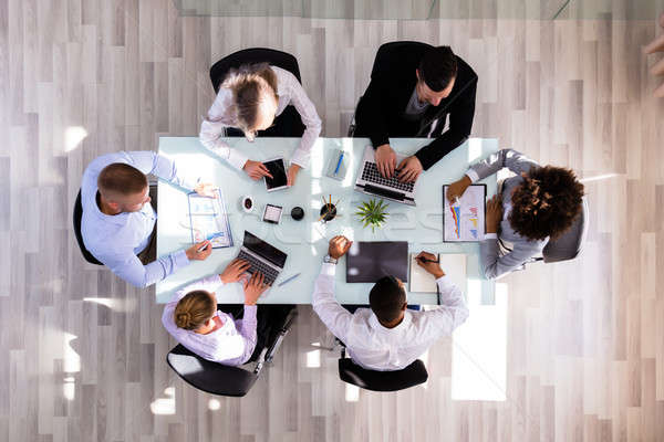 Businesspeople Working In Office Stock photo © AndreyPopov