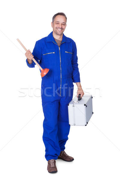 Happy Plumber Holding Plunger Stock photo © AndreyPopov