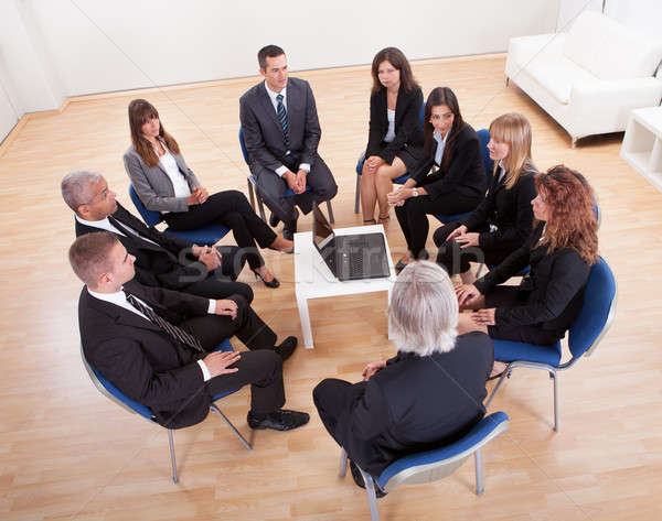 Stock photo: Group Of Business People Sitting On Chairs