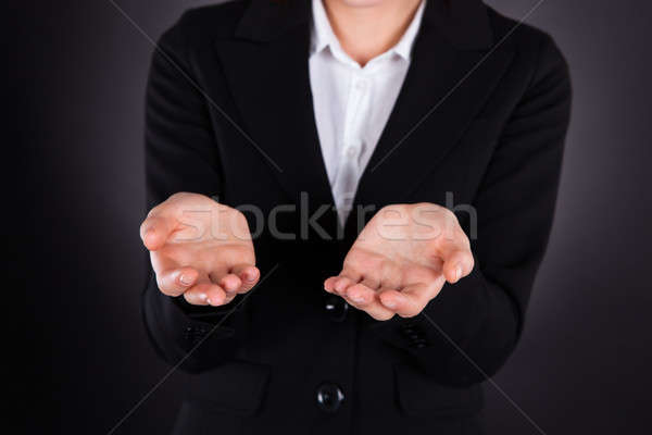 Midsection Of Businesswoman With Cupped Hands Stock photo © AndreyPopov