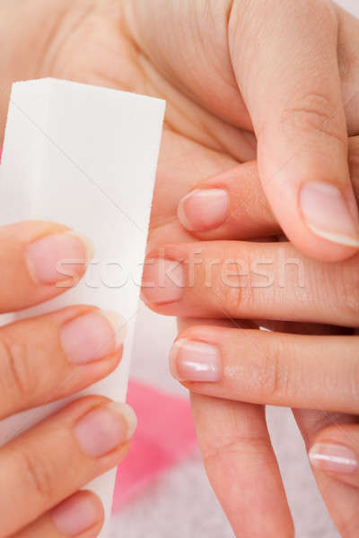 Beautician Filing The Nails Of Woman Stock photo © AndreyPopov
