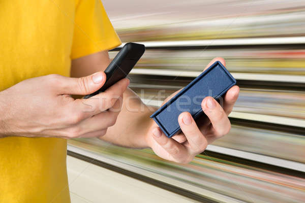 Stock photo: Man Scanning The Price On Box