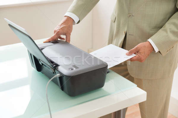 Businessman Using Scanner Stock photo © AndreyPopov