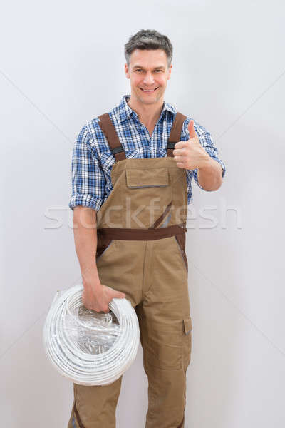Technician Holding Cable Stock photo © AndreyPopov