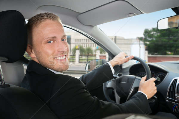 Happy Businessman In His Car Stock photo © AndreyPopov