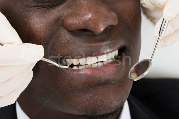 Doctor Doing Dental Check Up Of Patient Stock photo © AndreyPopov