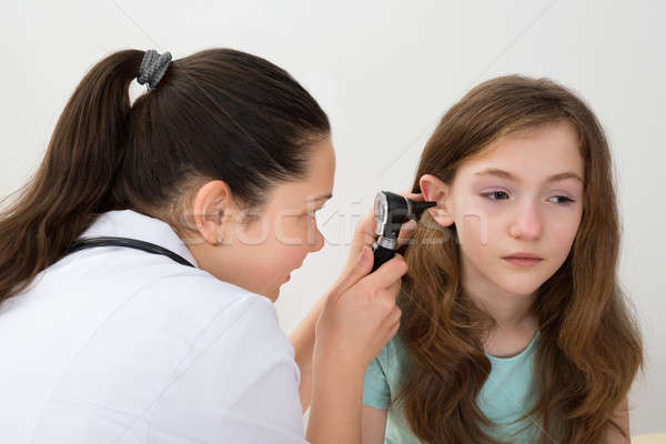 Doctor Examining Patient Ear With Otoscope Stock photo © AndreyPopov