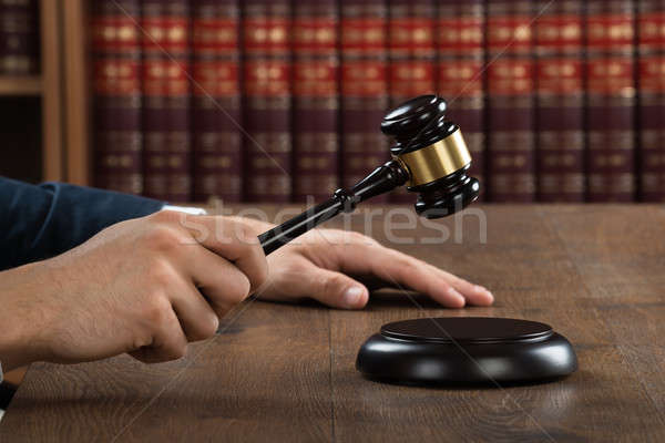 Judge Hitting Gavel At Desk Stock photo © AndreyPopov