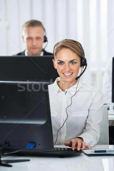 Female Employee Working In Call Center Stock photo © AndreyPopov