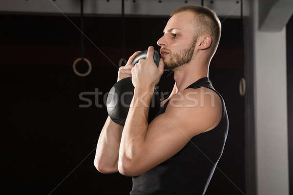 Homme bouilloire cloche portrait athlète Photo stock © AndreyPopov