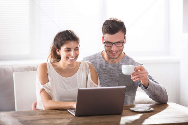 Stock photo: Couple Using Laptop