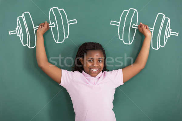 Smiling Girl Imaging Weightlifting Stock photo © AndreyPopov