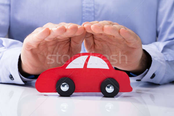Person Protecting Red Car Stock photo © AndreyPopov