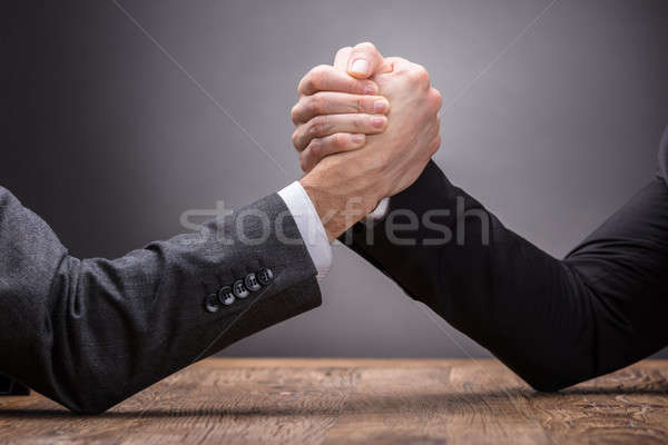Two Businesspeople Competing In Arm Wrestling Stock photo © AndreyPopov