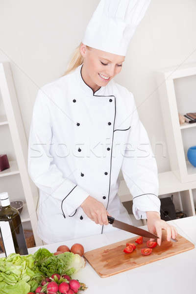 Cheerful woman chef cooking Stock photo © AndreyPopov