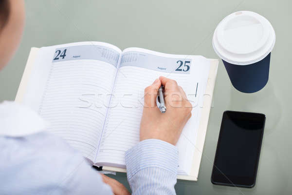Businessperson Working At Desk Stock photo © AndreyPopov