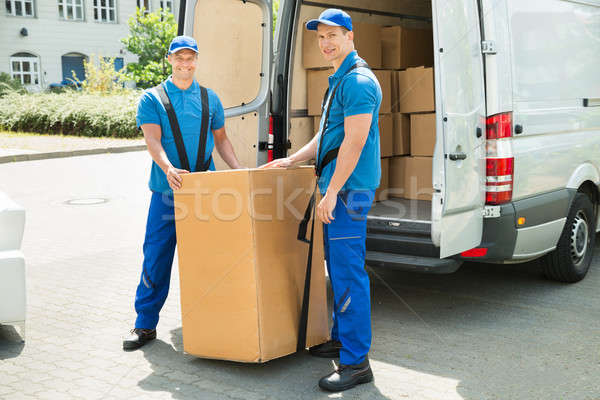 Dois caixas caminhão feliz azul uniforme Foto stock © AndreyPopov