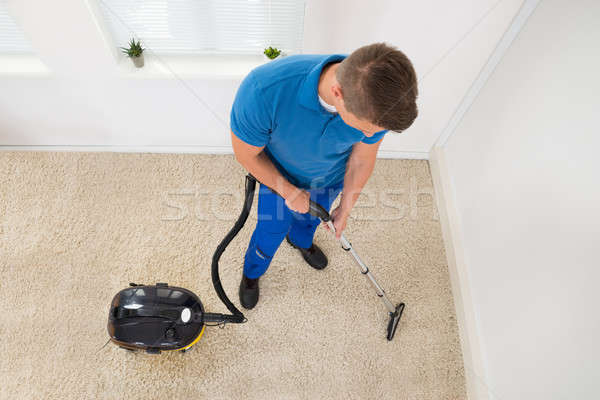 Worker Vacuuming Carpet Stock photo © AndreyPopov